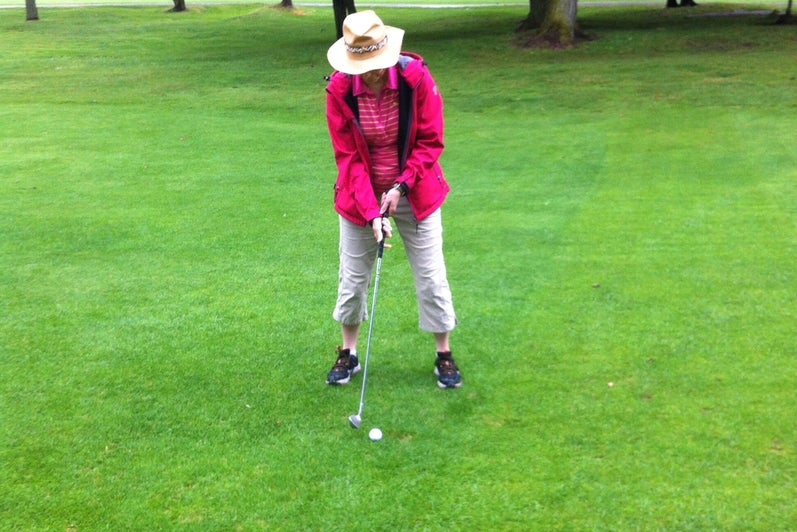 Margaret Insley golfing.