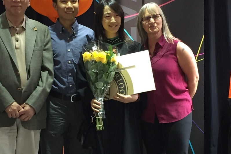 Christina Cao and faculty