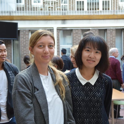 Two students standing next to each other