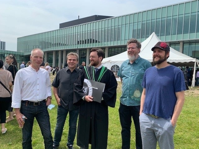 This year Andrew Gibson and fifteen other Economics graduate students earned their Master’s of Arts degree in June 2022. Pictured left to right are Dr. Busch, Dr. Chaussé, Andrew Gibson, Dr. Curry and Dr. Forand. (Photo credit: Maureen Stafford.)