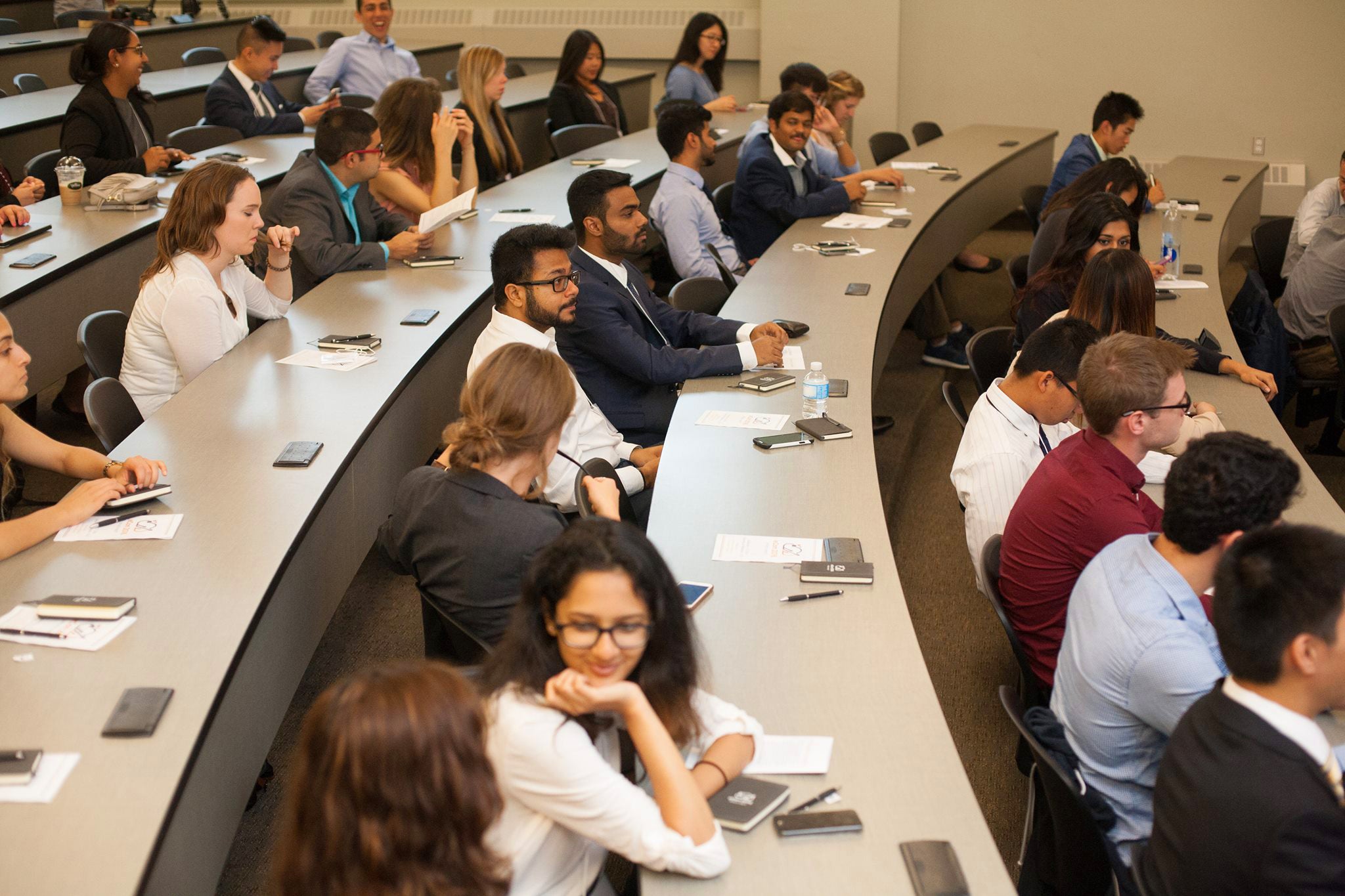 students at desks in lecture hall