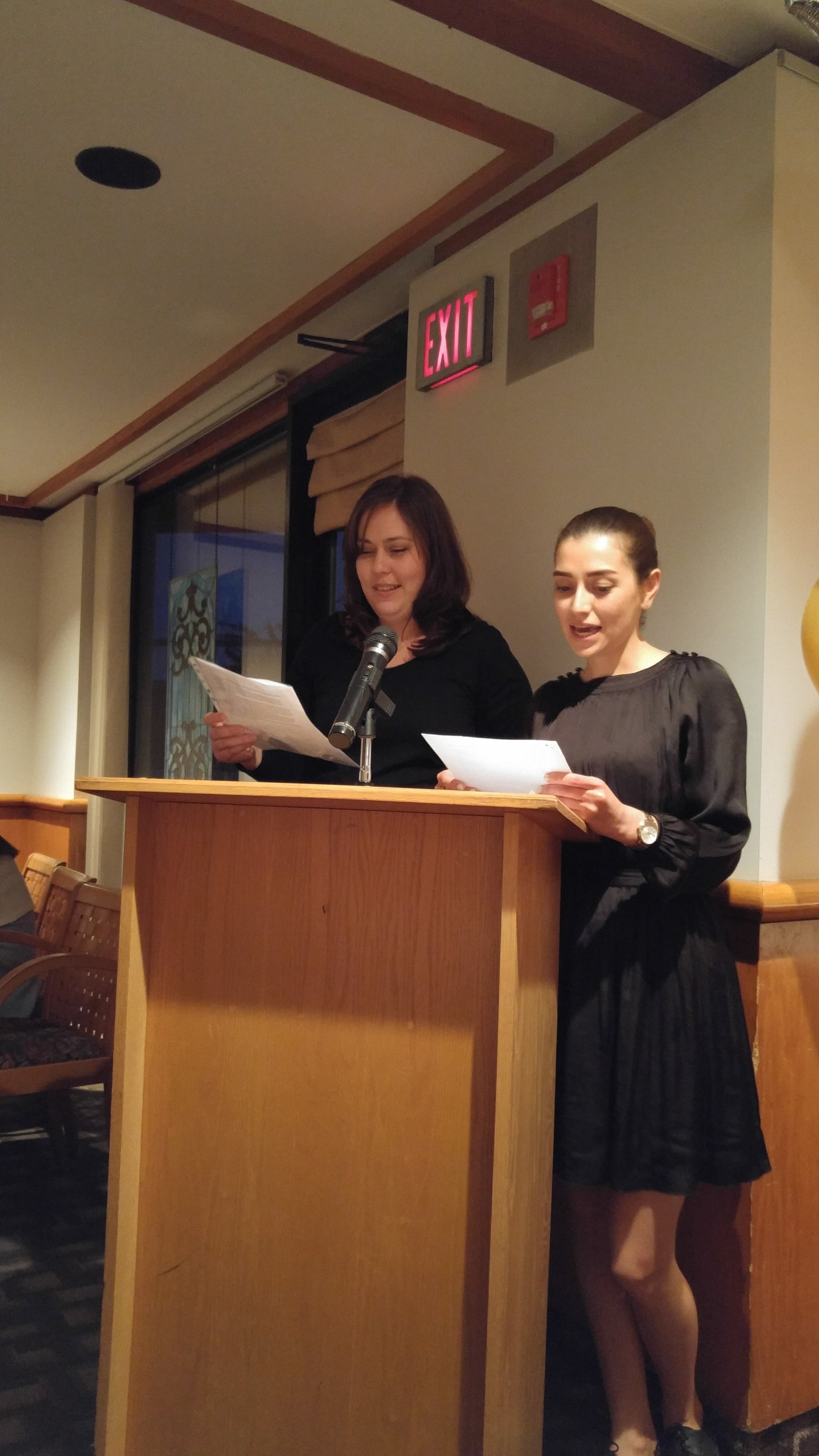 Photo of Allison Mascella and Ghazal Memartoluie at podium