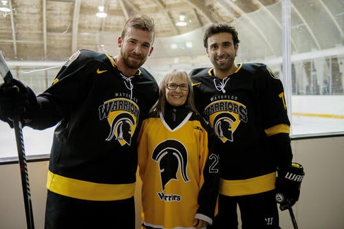 Mary Ann Vaughan and two hockey players