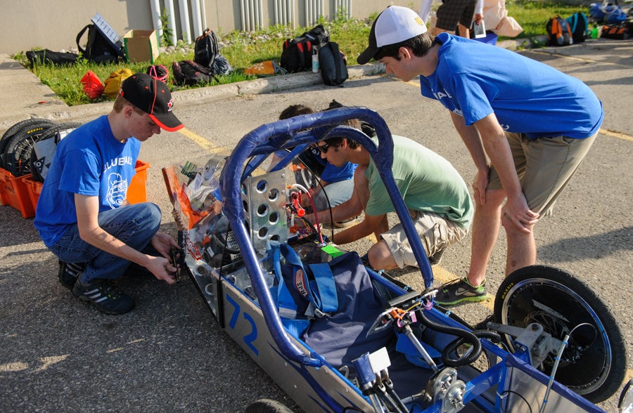 Team working on their car