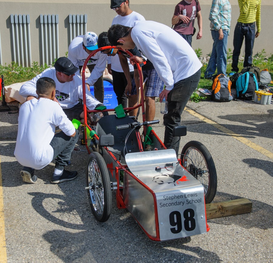 Stephen Lewis Secondary School working on their car
