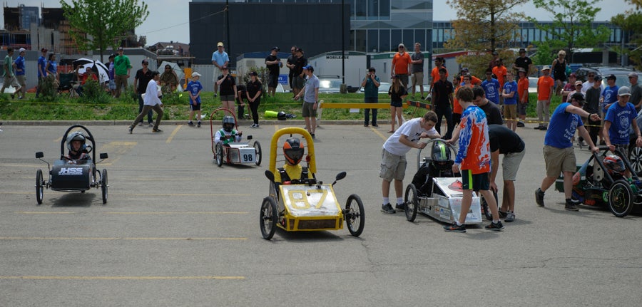 Cars in the pits after the 12 V race