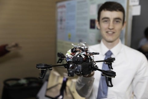 ECE student showcasing a drone