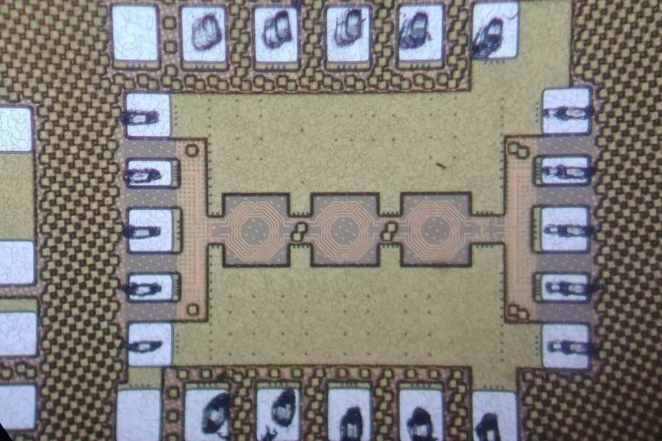 Die photograph of a digitally-assisted reflection-type phase shifter for 27 to 33 GHz, cropped to the chip and surrounded by bond pads