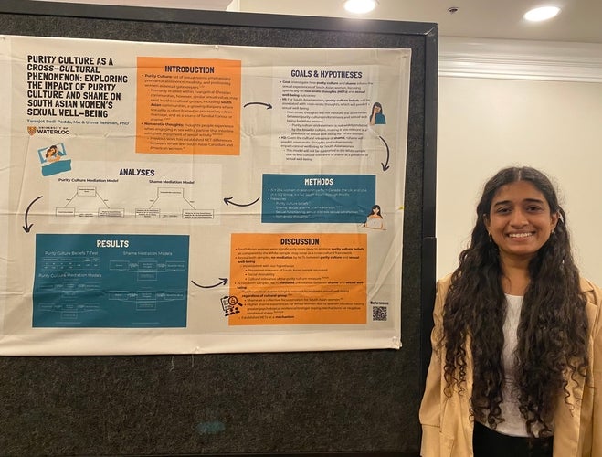 Taranjot Padda with her poster at a conference