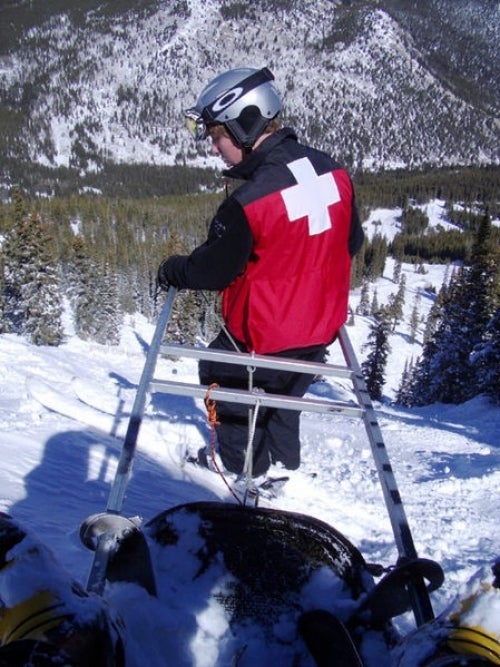 Ski patroller handling a rescue toboggan 