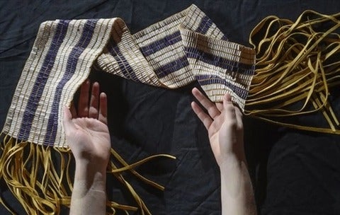 Two row wampum in hands