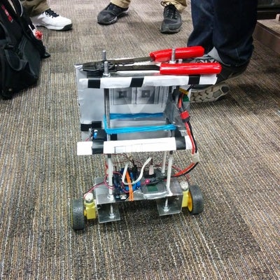 Self-balancing robot run by Arduino holding wire crimpers.