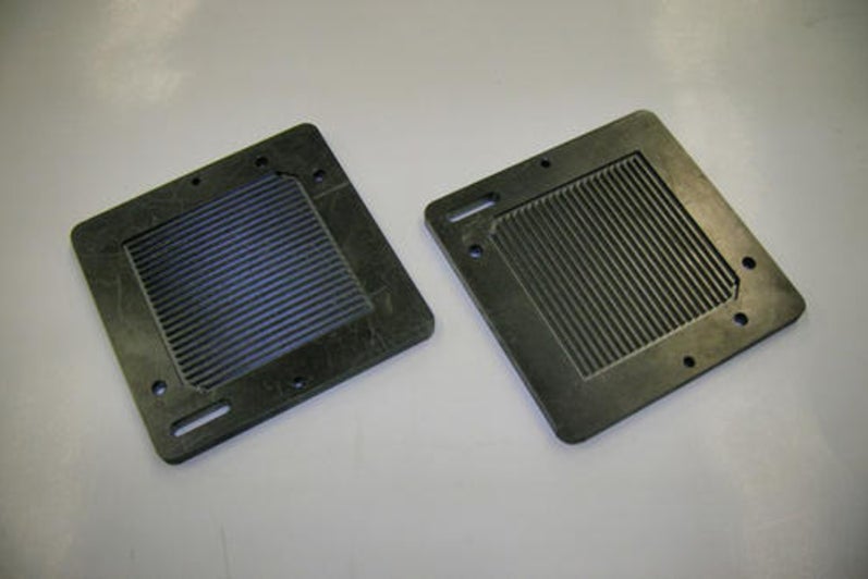 Graphite fuel cell plates