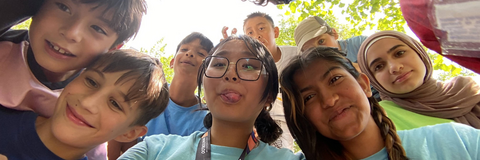 Camper leaders and camper taking a selfie
