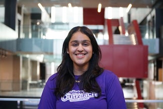Girl in purple tshirt smiling