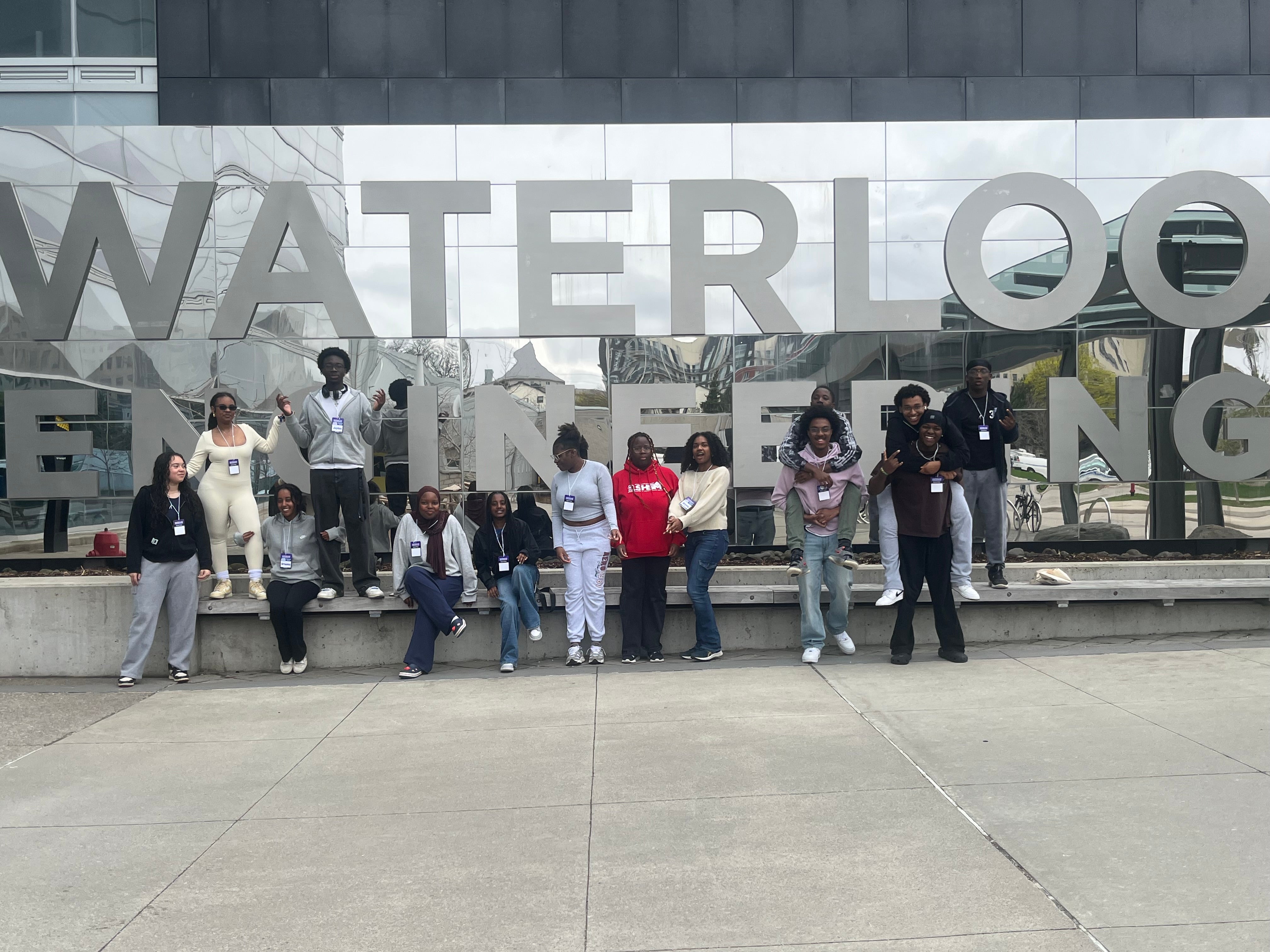 One group of STEMpowered students take a photo in front of the Waterloo Engineering sign