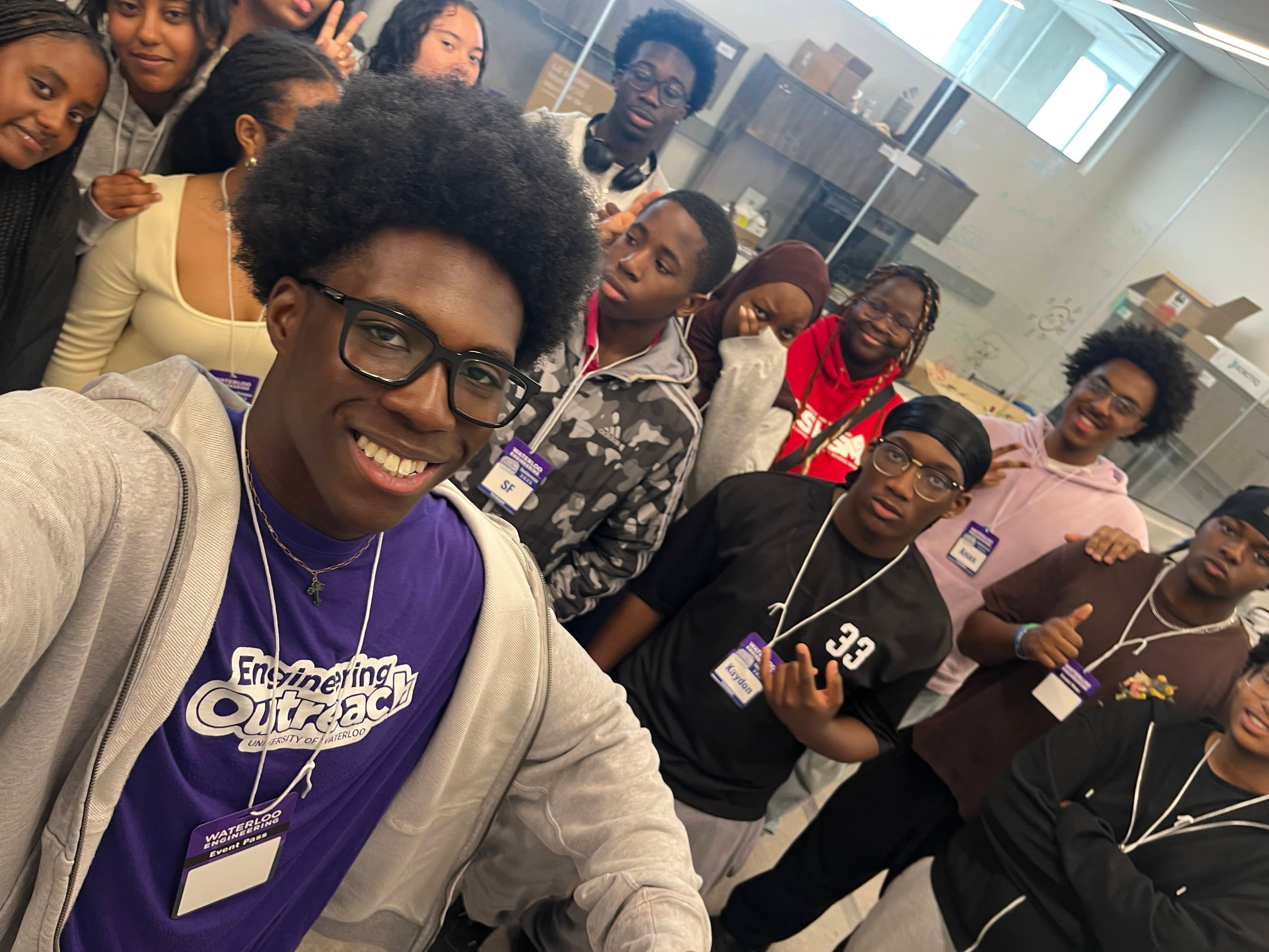 STEMpowered facilitator takes group photo with one their scavenger hunt team