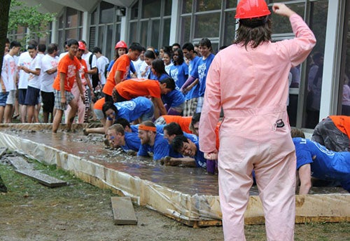 Students in the Orientation Week mud pit.