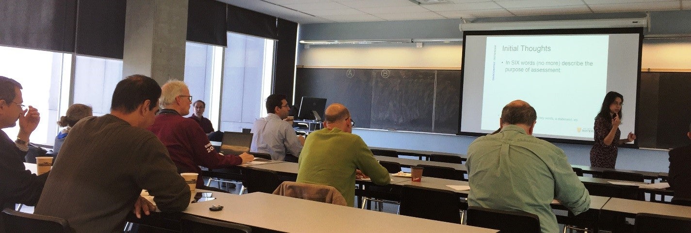 Workshop participants sitting in a classroom listening to the facilitator