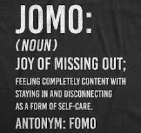 sign defining JOMO