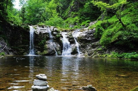 waterfall beside lake