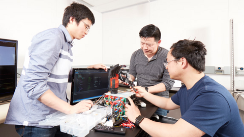 Ning Jiang with two students