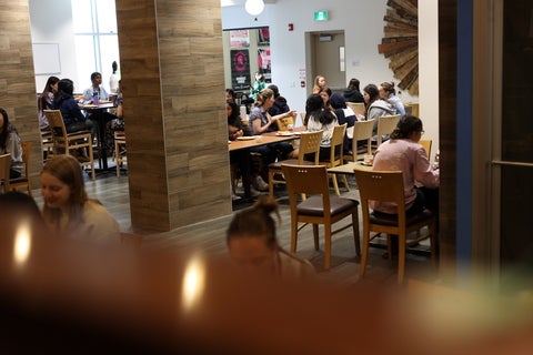 A group of women sitting together at Watson's Eatery at United College