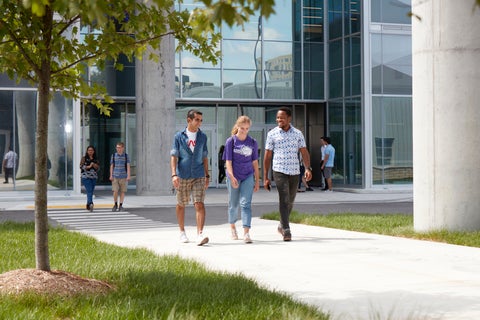 Students walking together in front of engineering building