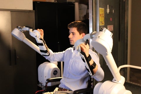 man using robotic arm
