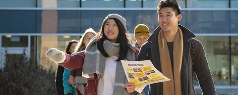 Family walking on campus