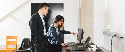 People looking at computer together
