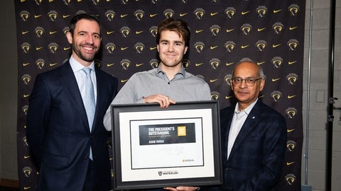 Adam Huras (centre) with President Vivek Goel (right)