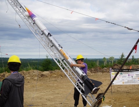 Student erect rocket for lift off