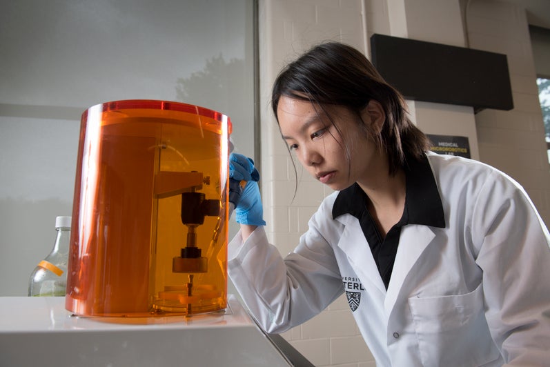 Woman looking at a machine 