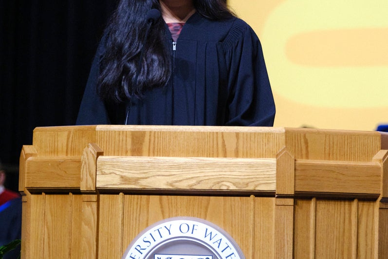 The valedictorian speaks from the podium