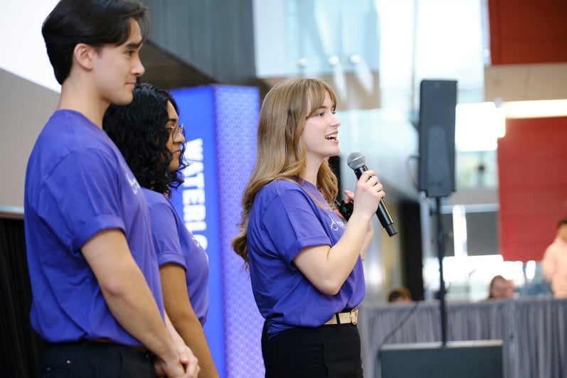 Student talking into microphone