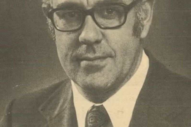 A man looks at the camera.