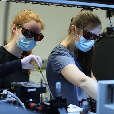 Two students working in lab