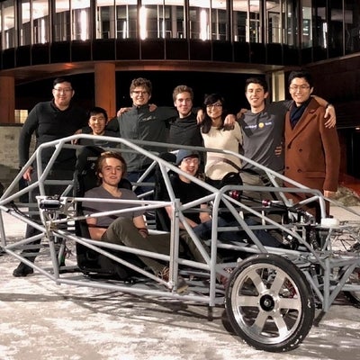 Student design team in car prototype