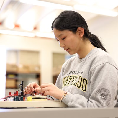 Student working in electronics lab