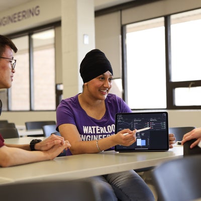 Students looking at data on an ipad
