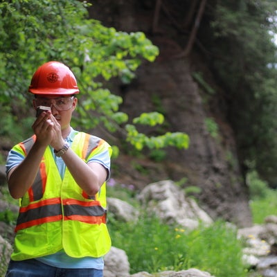 Student analyzing rock