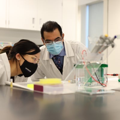 Student and professor in lab