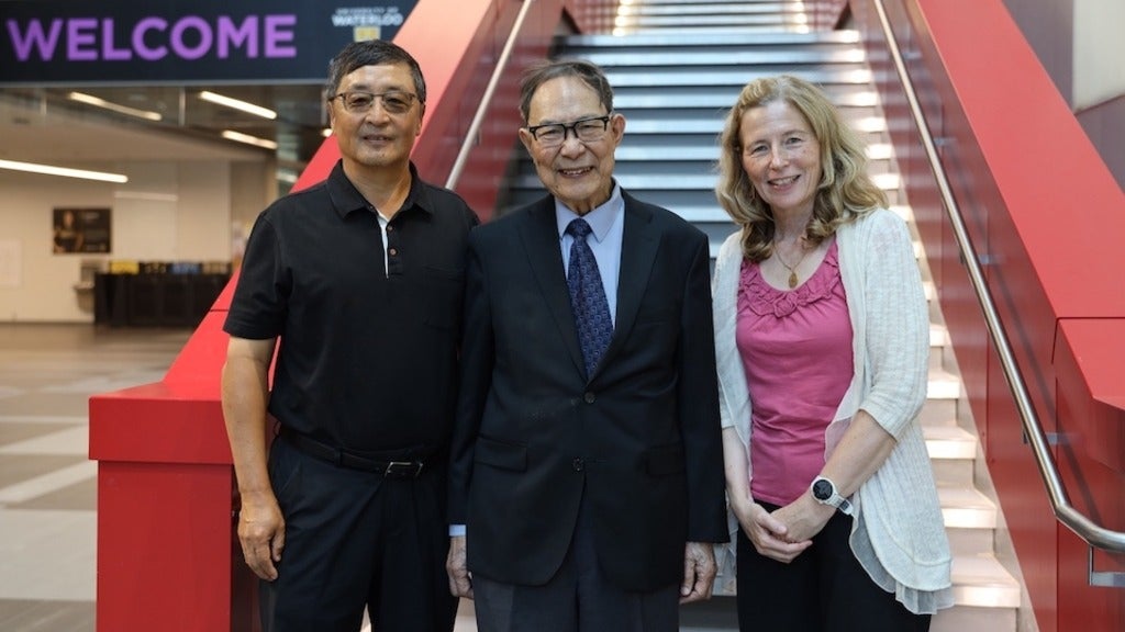 Three people standing together