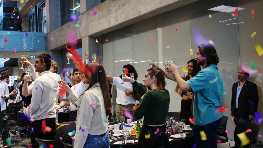 Chemical engineering and nanotechnology engineering students celebrating with confetti