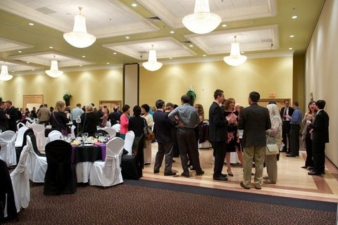 Attendees mingle around at the faculty dinner