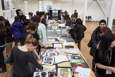 Architecture students displaying portfolios