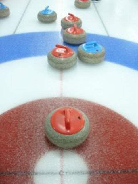 curling on sheet of ice