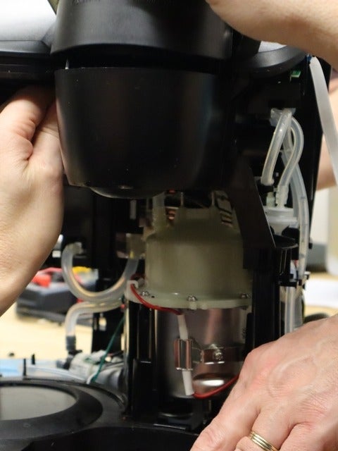Broken coffee machine being fixed