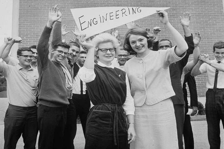 Group of engineering students with engineering sign.